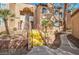 Beautiful condo with a charming courtyard entrance and stairs leading to the upper levels at 9325 W Desert Inn Rd # 120, Las Vegas, NV 89117