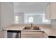 Bright kitchen featuring stainless steel dishwasher, ample counter space, and white cabinetry at 9325 W Desert Inn Rd # 120, Las Vegas, NV 89117