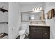 Bathroom with sleek vanity, ample lighting, and stylish shelves at 942 Westminster Ave, Las Vegas, NV 89119