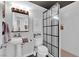 Modern bathroom with stand alone shower, vanity and updated fixtures at 942 Westminster Ave, Las Vegas, NV 89119