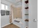 A well-lit bathroom featuring a shower and built-in shelves, offering both functionality and style at 942 Westminster Ave, Las Vegas, NV 89119