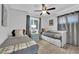 This cozy bedroom boasts a ceiling fan, and natural light making it ideal for relaxing at 942 Westminster Ave, Las Vegas, NV 89119