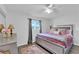 Bright bedroom featuring a comfortable bed, plush rug, and neutral decor at 942 Westminster Ave, Las Vegas, NV 89119