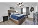 This bedroom boasts a ceiling fan, stylish decor, and plush carpet adding warmth and sophistication at 942 Westminster Ave, Las Vegas, NV 89119