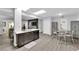 Modern kitchen featuring stainless steel appliances, dark cabinetry, and eat-in dining area at 942 Westminster Ave, Las Vegas, NV 89119