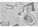 Functional laundry room with washer, dryer, and ample storage space at 942 Westminster Ave, Las Vegas, NV 89119