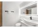 Modern bathroom features a stylish vessel sink, lighted mirror, and sleek fixtures at 9795 La Cienega St, Las Vegas, NV 89183