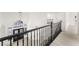 Elegant foyer featuring a decorative banister, and modern light fixture at 9795 La Cienega St, Las Vegas, NV 89183