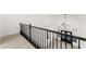 Bright foyer featuring black decorative banister and a modern light fixture at 9795 La Cienega St, Las Vegas, NV 89183
