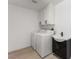 Laundry room equipped with a washer, dryer, sink and storage cabinet at 9795 La Cienega St, Las Vegas, NV 89183