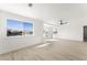Bright living room with large windows, a ceiling fan, and French doors at 9795 La Cienega St, Las Vegas, NV 89183