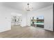 Spacious living room with a sliding glass door to the pool area and an open view to the kitchen at 9795 La Cienega St, Las Vegas, NV 89183