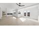 Bright living room with an electric fireplace, French doors and mountain views at 9795 La Cienega St, Las Vegas, NV 89183