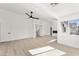 Open-concept living room with lots of windows, and an electric fireplace at 9795 La Cienega St, Las Vegas, NV 89183
