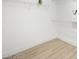 Clean walk-in closet with ample shelving and wood-look flooring at 9795 La Cienega St, Las Vegas, NV 89183