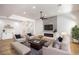 Bright living room with a modern fireplace, sleek ceiling fan and neutral furniture at 10405 Junction Hill Dr, Las Vegas, NV 89134
