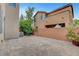 An inviting backyard featuring a brick-paved patio and a well-maintained brick wall providing privacy at 10410 Poplar Park Ave, Las Vegas, NV 89166