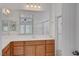 Well-lit bathroom featuring double sinks, lots of light, and shower at 10410 Poplar Park Ave, Las Vegas, NV 89166