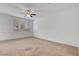 Bright and airy bedroom with neutral walls, a ceiling fan, and natural light at 10410 Poplar Park Ave, Las Vegas, NV 89166