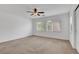 Spacious primary bedroom with a ceiling fan and window at 10410 Poplar Park Ave, Las Vegas, NV 89166