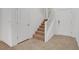 Bright entryway showcasing tiled floors, stairway, and neutral paint at 10410 Poplar Park Ave, Las Vegas, NV 89166