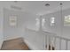 Second floor hallway with neutral carpet and paint colors at 10410 Poplar Park Ave, Las Vegas, NV 89166