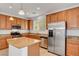 Bright kitchen with an island, stainless steel appliances, granite countertops, and ample storage space at 10410 Poplar Park Ave, Las Vegas, NV 89166