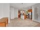 Bright kitchen with stainless steel appliances, tile floors, island, and light wood cabinets at 10410 Poplar Park Ave, Las Vegas, NV 89166