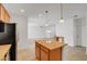 Bright kitchen with an island, stainless steel appliances and an adjacent dining area at 10410 Poplar Park Ave, Las Vegas, NV 89166