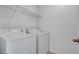 A laundry room featuring a washer and dryer along with wire shelving for storage at 10410 Poplar Park Ave, Las Vegas, NV 89166