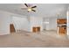 Expansive living room with staircase, adjacent dining area, and plenty of natural light at 10410 Poplar Park Ave, Las Vegas, NV 89166