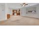 Open-concept living room flowing into the kitchen, creating a seamless entertaining space at 10410 Poplar Park Ave, Las Vegas, NV 89166