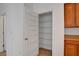 Pantry featuring adjustable racks, adjacent to the kitchen at 10410 Poplar Park Ave, Las Vegas, NV 89166