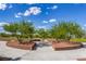 Landscaped common area provides mature trees and garden features in this well maintained community at 10410 Poplar Park Ave, Las Vegas, NV 89166