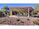 Community playground features a sheltered picnic area and multiple play structures for children at 10410 Poplar Park Ave, Las Vegas, NV 89166