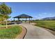 Picturesque park ramada for neighborhood residents, offering beautiful mountain views from a manicured green space at 10410 Poplar Park Ave, Las Vegas, NV 89166