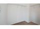 A walk-in closet featuring wire shelving and neutral carpeting at 10410 Poplar Park Ave, Las Vegas, NV 89166