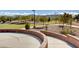 Curving sidewalk borders manicured landscaping in this lovely park-like setting at 10410 Poplar Park Ave, Las Vegas, NV 89166