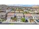 Wide aerial shot of Las Vegas homes featuring tile roofs in a planned community at 10432 Britton Hill Ave, Las Vegas, NV 89129