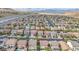 Overhead view of a Las Vegas neighborhood with many tile roofs in a desert landscape at 10432 Britton Hill Ave, Las Vegas, NV 89129