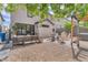 Outdoor oasis featuring a patio, gravel area, and covered seating with well manicured landscaping at 10432 Britton Hill Ave, Las Vegas, NV 89129