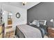 Comfortable bedroom with neutral tones, stylish furnishings, and an en-suite bathroom at 10432 Britton Hill Ave, Las Vegas, NV 89129