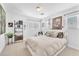 Airy bedroom with ample sunlight, decorative shelving, and minimalist decor at 10432 Britton Hill Ave, Las Vegas, NV 89129
