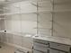 Walk-in closet with an adjustable organizing system with shelves and drawers for optimized storage at 10432 Britton Hill Ave, Las Vegas, NV 89129