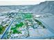 Community park aerial shot with playgrounds, green areas, and mountain backdrop at 10432 Britton Hill Ave, Las Vegas, NV 89129