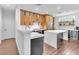 Contemporary kitchen with white countertops, wooden cabinets, and modern fixtures at 10432 Britton Hill Ave, Las Vegas, NV 89129