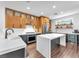 Modern kitchen with stainless steel appliances, custom cabinets, quartz countertop island, and subway tile backsplash at 10432 Britton Hill Ave, Las Vegas, NV 89129