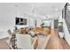 Inviting living room with comfortable seating, modern entertainment center, and seamless flow at 10432 Britton Hill Ave, Las Vegas, NV 89129