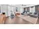 Spacious living room featuring hardwood floors, comfortable seating, and plenty of natural light at 10432 Britton Hill Ave, Las Vegas, NV 89129