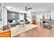 Spacious living area features modern ceiling fan, recessed lighting, and sleek hardwood flooring at 10432 Britton Hill Ave, Las Vegas, NV 89129